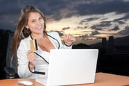 woman with laptop an dcredit card